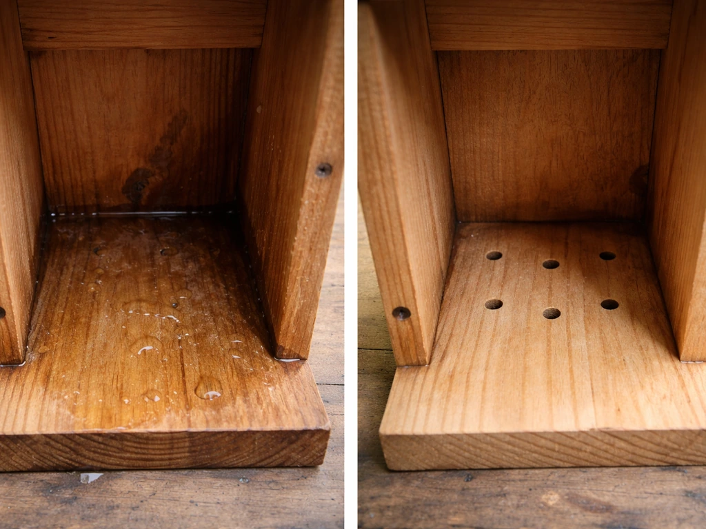 Close-up inside a wooden birdhouse showing a wet floor versus a floor with drainage holes.